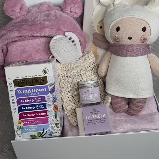 video of a baby Girl hamper with knitted doll and baby dressing gown