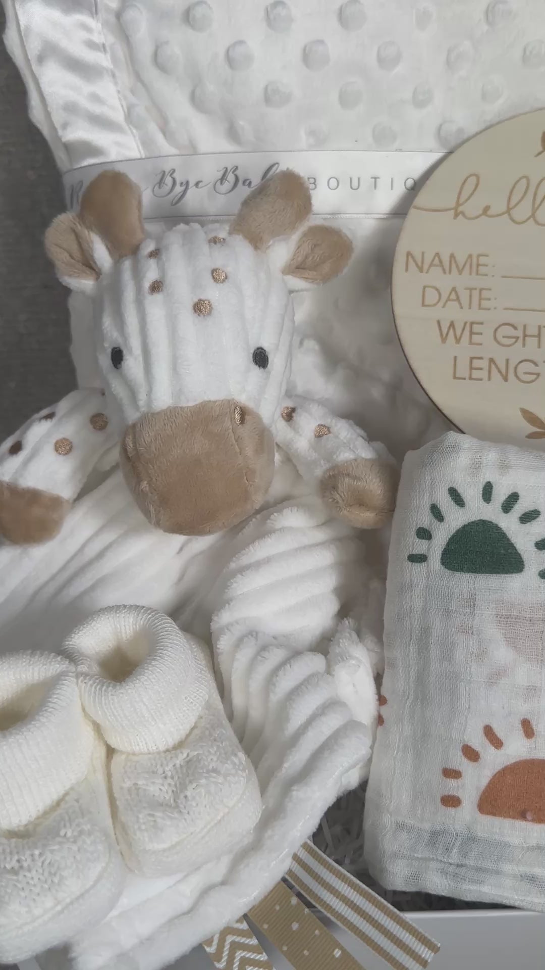 video of a baby hamper gift with giraffe baby comforter