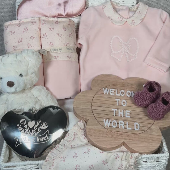 video of a baby hamper with Bi GI winter garden baby clothing and baby blanket