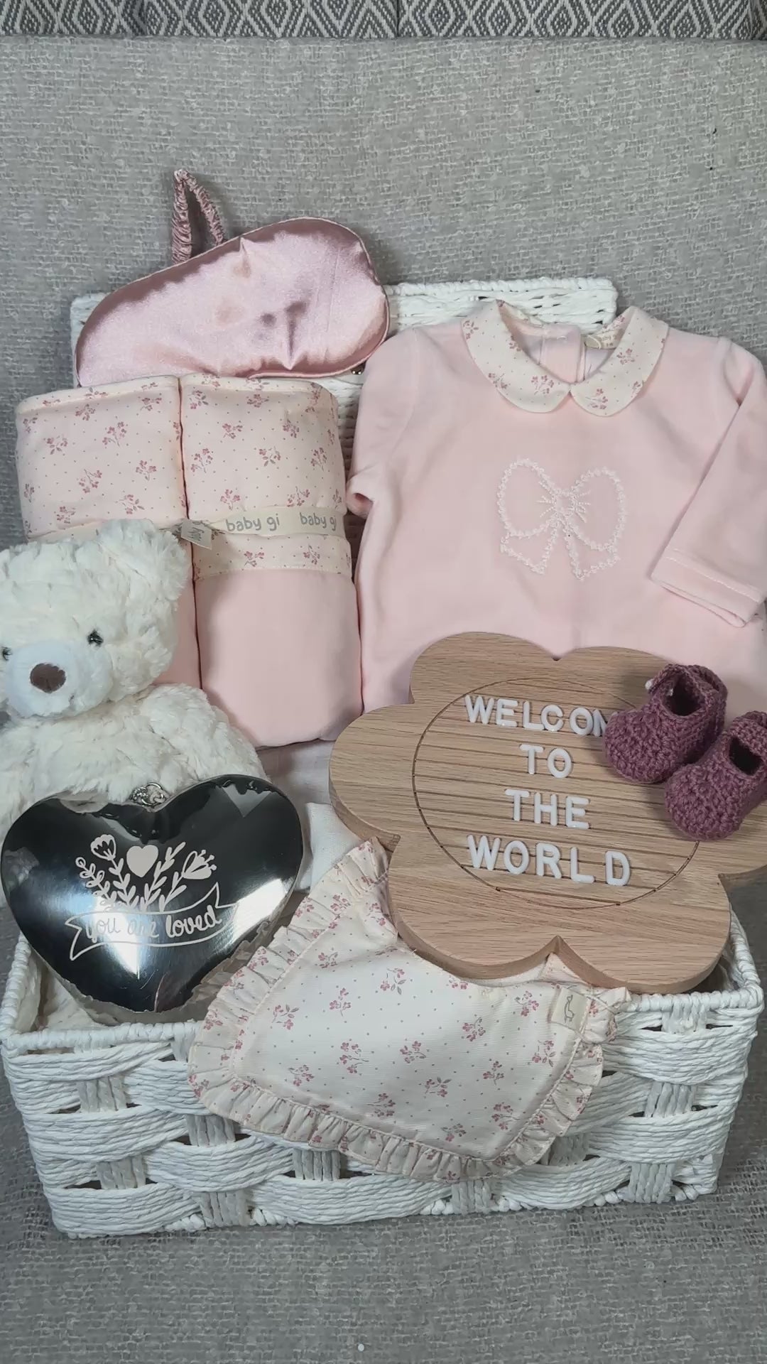 video of a baby hamper with Bi GI winter garden baby clothing and baby blanket