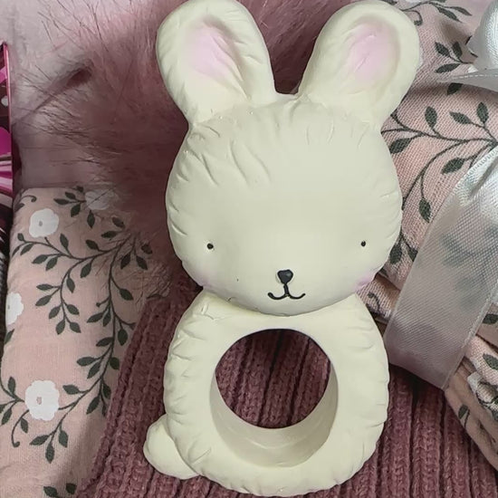 Video f a new baby girl hamper, blossom print swaddle and muslins bunny baby teether.