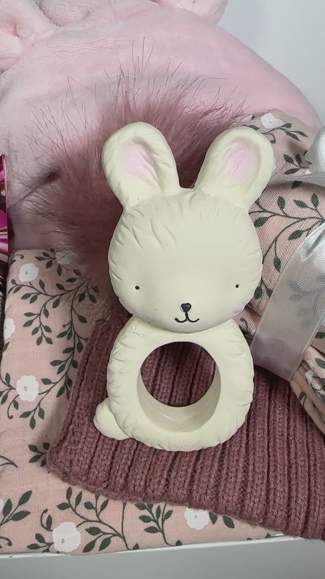 Video f a new baby girl hamper, blossom print swaddle and muslins bunny baby teether.