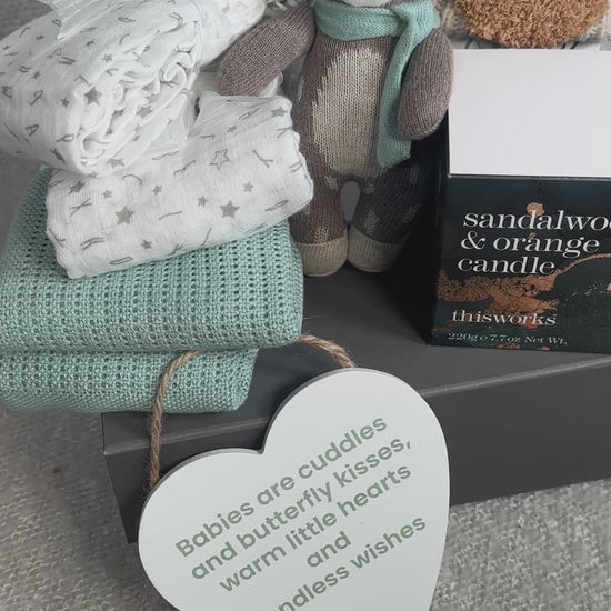 Video unisex baby hamper gift with bear soft toy, baby blanket, muslins and a candle.