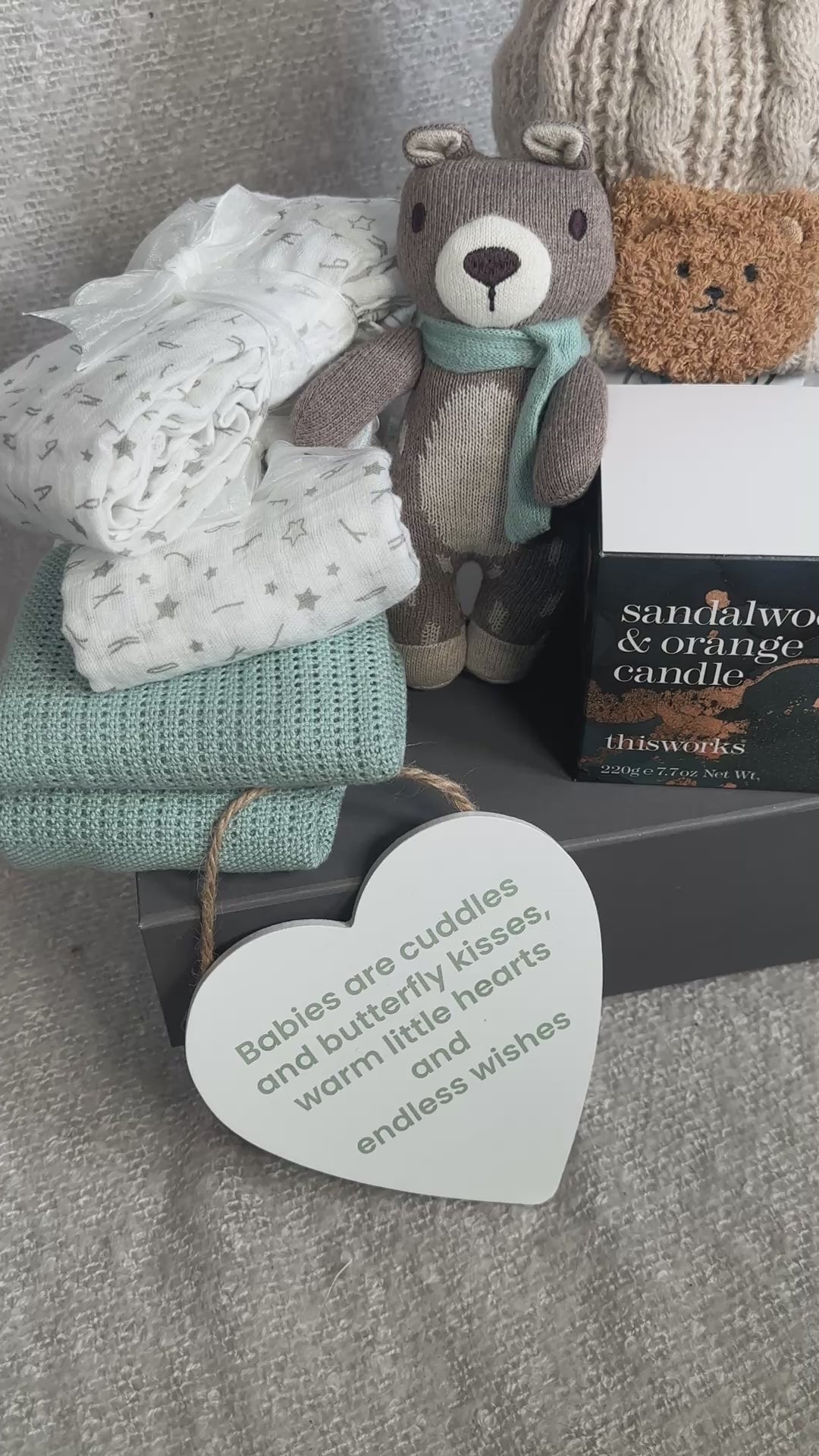 Video unisex baby hamper gift with bear soft toy, baby blanket, muslins and a candle.