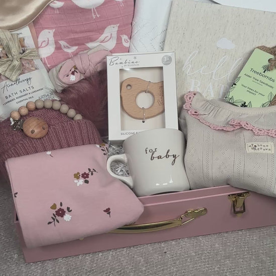 video of a baby girl gift hamper in a pink keepsake case