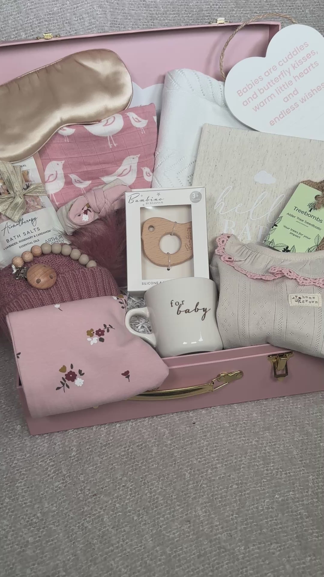 video of a baby girl gift hamper in a pink keepsake case
