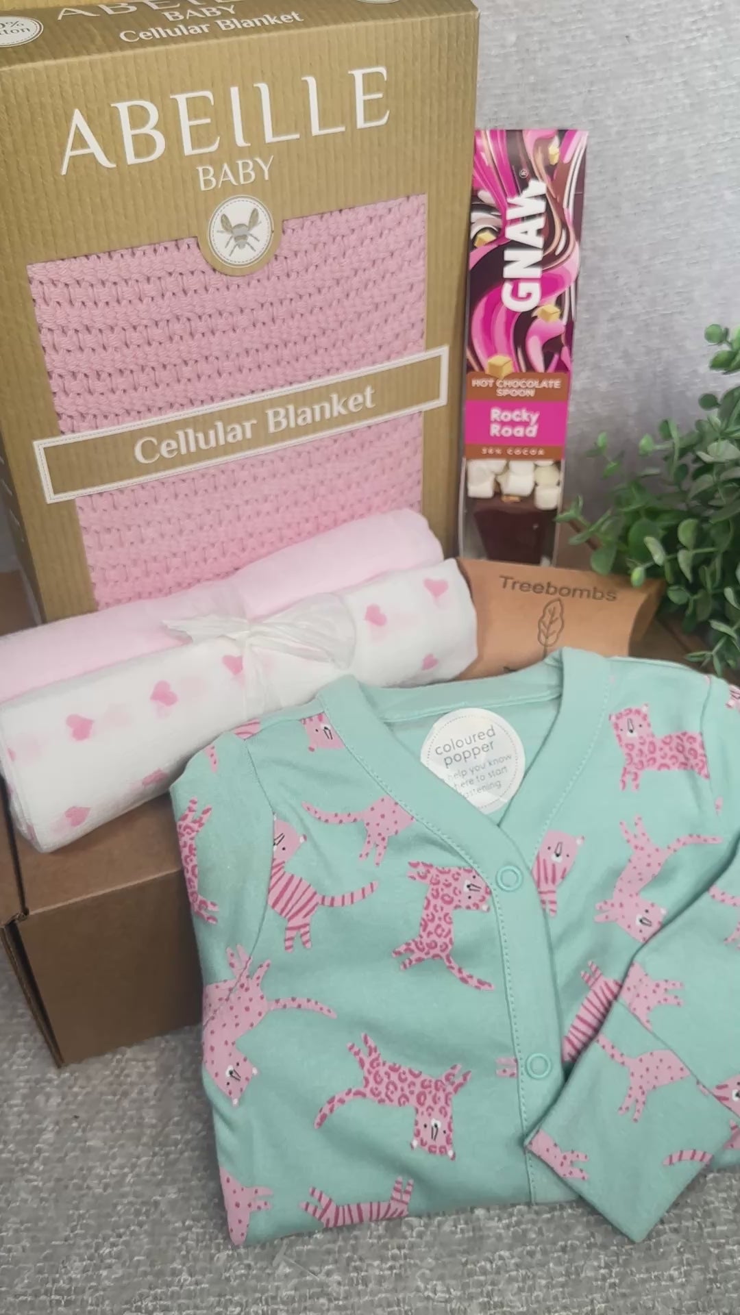 Baby girl hamper gift with pink blanket and sleepsuit with tiger print- video