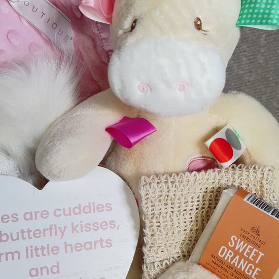 Video of  a new baby girl hamper with to-illy Taggie giraffe soft baby toy, pink baby blanket and soap