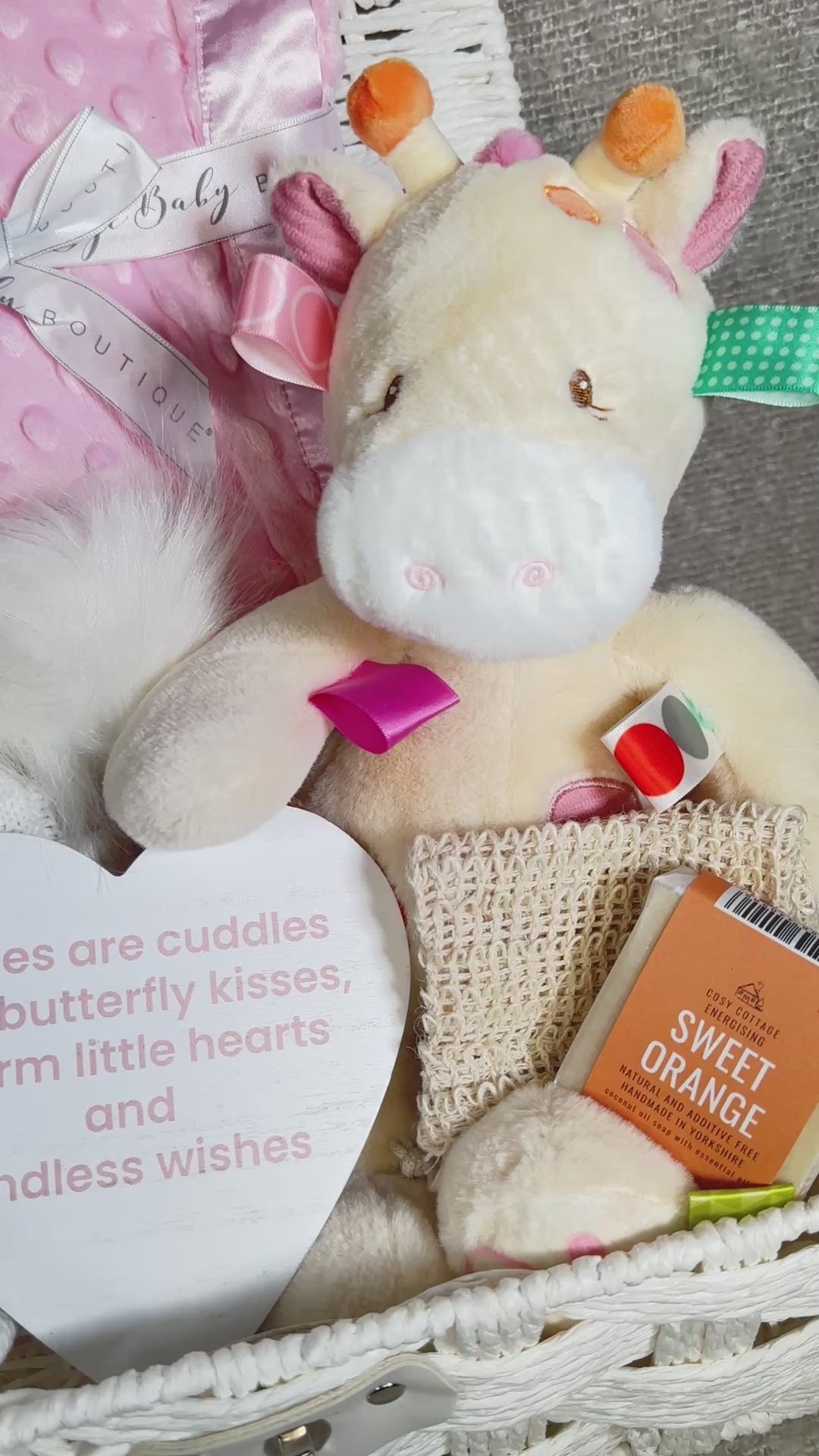 Video of  a new baby girl hamper with to-illy Taggie giraffe soft baby toy, pink baby blanket and soap