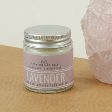 Lavender hand and body cream in a glass jar.