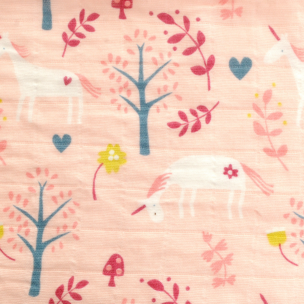 baby MUSLIN pattern with unicorns, trees, and flowers on a pink background