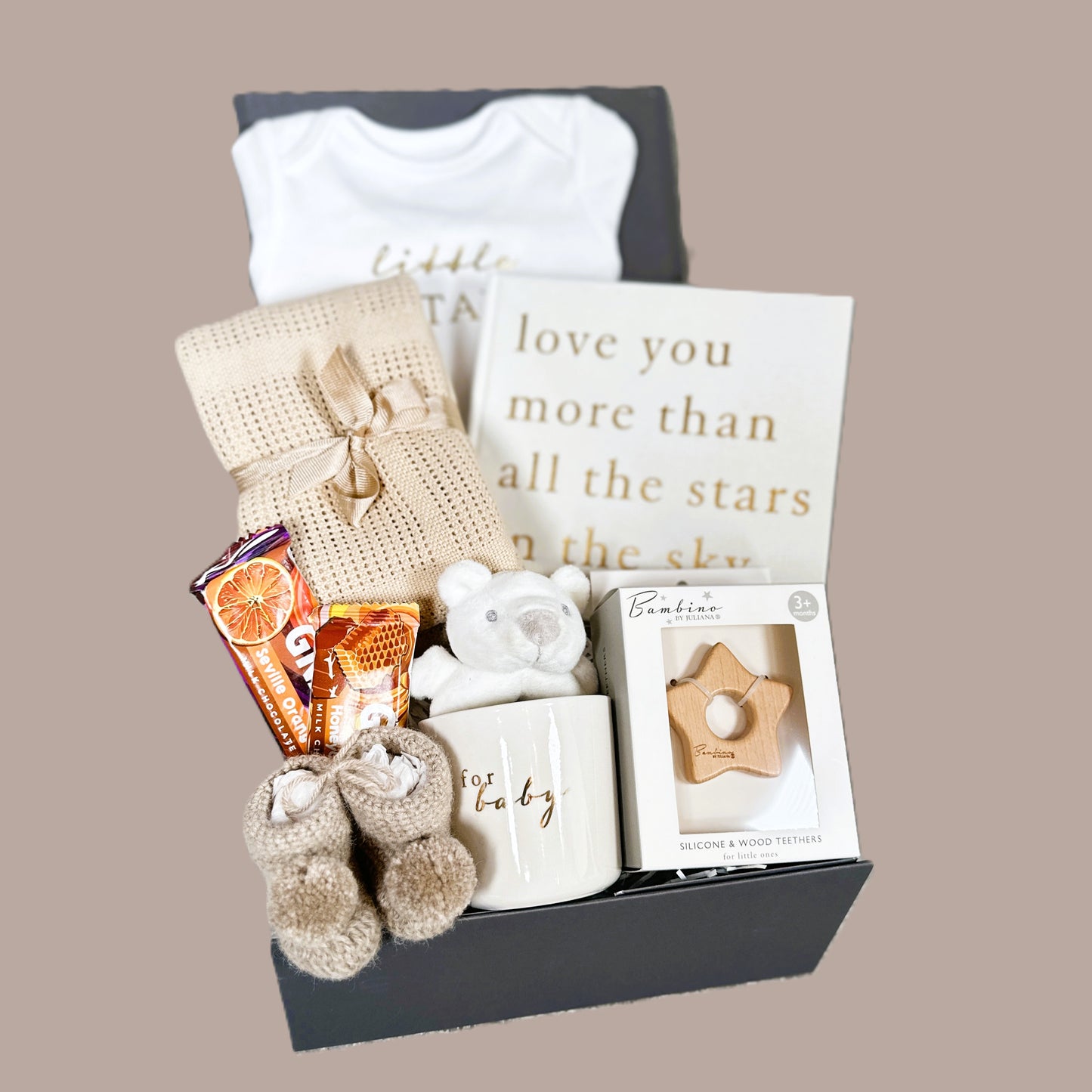 unisex new baby hamper with baby photo album , baby clothing, chocolate and baby booties,