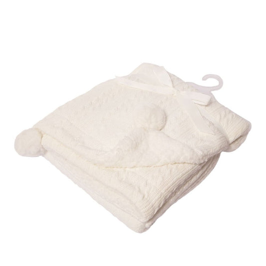 white cable knit pattern baby blanket with sherpa lining and 2 pompoms.