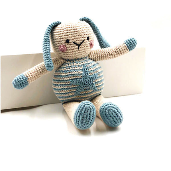 Crocheted baby bunny toy in cream and blue.
