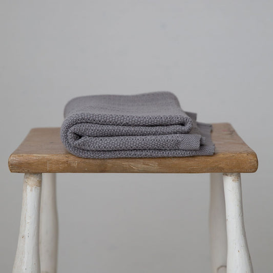 Grey cellular baby blanket.